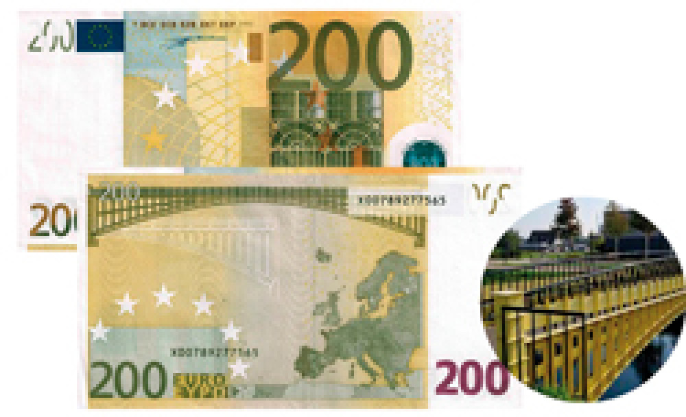 Банкнота 200 евро в желтых тонах демонстрирует стиль модерн.